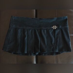 Black Pleated Mini Skirt with Buckle Detail